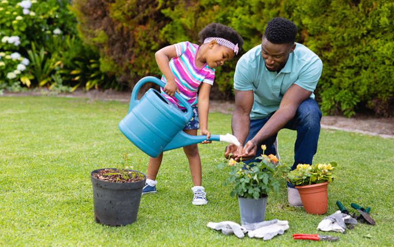 Children planting native flowers in DFW backyard garden.